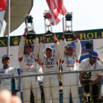 marco-werner-40-jahre-motorsport-curbs-historischer-motorsport-magazin-Auf-dem-Sieger-Podest-2005-in-Le-Mans